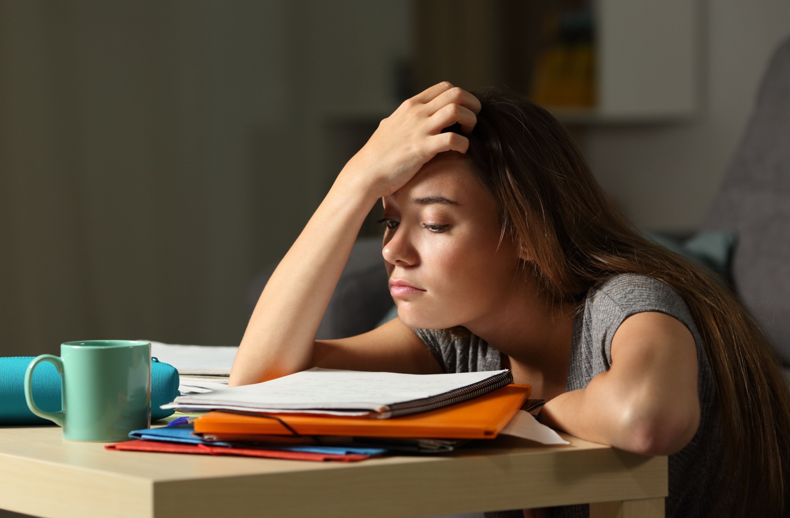 A student struggles to see clearly while studying.